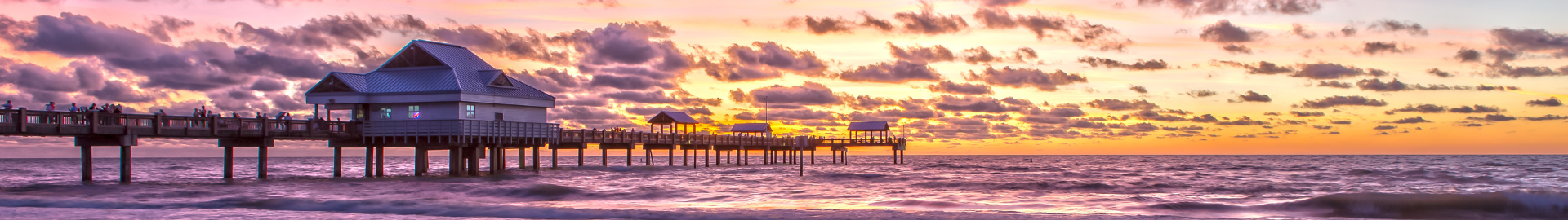 Clearwater Beach, Florida with white sandy shores, turquoise Gulf waters, beachfront resorts, family-friendly activities, water sports, dining, and vibrant coastal lifestyle.