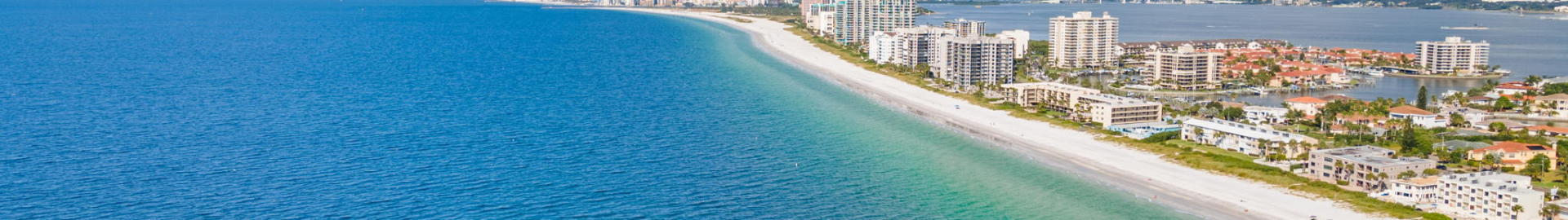 Belleair, Florida neighborhood with upscale homes, tree-lined streets, waterfront properties, and close proximity to beaches, parks, shopping, and dining in Pinellas County.