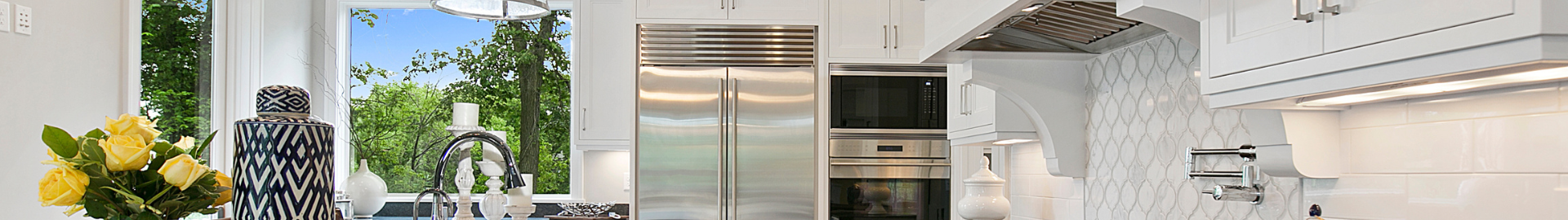 Luxury kitchen in Avila Tampa custom home with high-end finishes, large island, and modern design