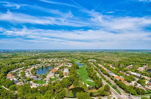 Modern Westchase homes with manicured lawns and driveways in Tampa