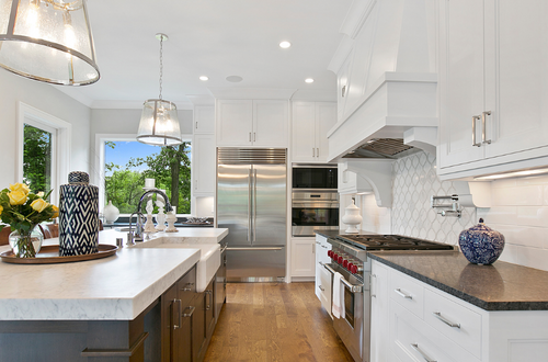 Luxury kitchen in Avila Tampa custom home with high-end finishes, large island, and modern design