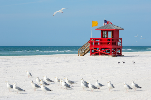 Siesta Key, Florida world-famous beach destination with powdery white quartz sand, turquoise Gulf waters, beachfront homes, resorts, dining, and vibrant coastal lifestyle near Sarasota.