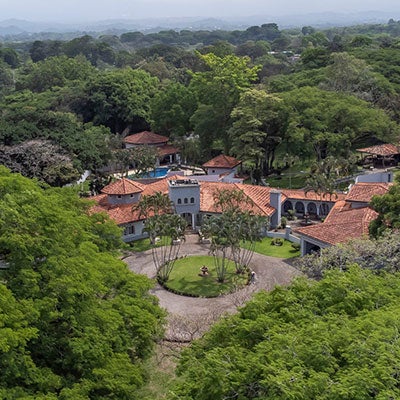 main entrance of a luxury hacienda with garden