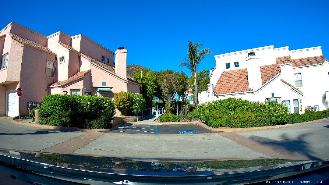 Street-level view in La Mesa highlighting a pair of high-end residences.