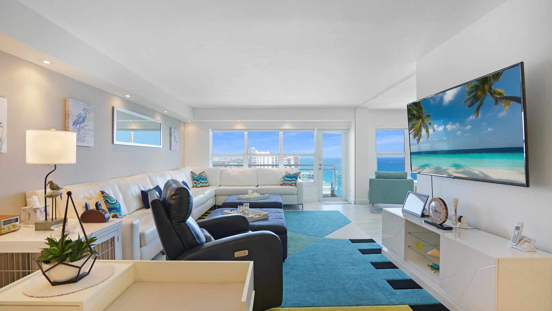 Step into this bright, open-concept living room featuring floor-to-ceiling windows that showcase endless Atlantic Ocean views. This breathtaking Galt Ocean Mile condo offers the ultimate beachfront lifestyle. property photo of Step into this bright, open-concept living room featuring floor-to-ceiling windows that showcase endless Atlantic Ocean views. This breathtaking Galt Ocean Mile condo offers the ultimate beachfront lifestyle.