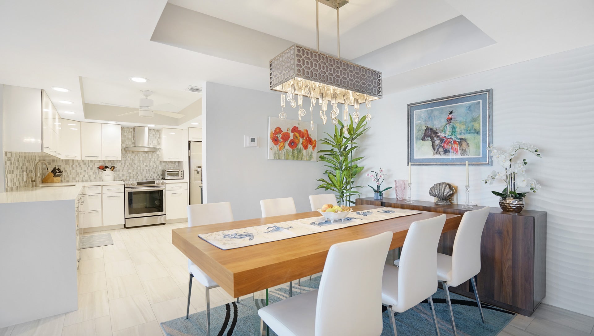 Host dinner parties in this elegant dining area that flows seamlessly into the gourmet kitchen. A perfect setup for luxury beachfront living at 3900 Galt Ocean Dr, presented by Prestige Waterfront Realty. property photo for Host dinner parties in this elegant dining area that flows seamlessly into the gourmet kitchen. A perfect setup for luxury beachfront living at 3900 Galt Ocean Dr, presented by Prestige Waterfront Realty.