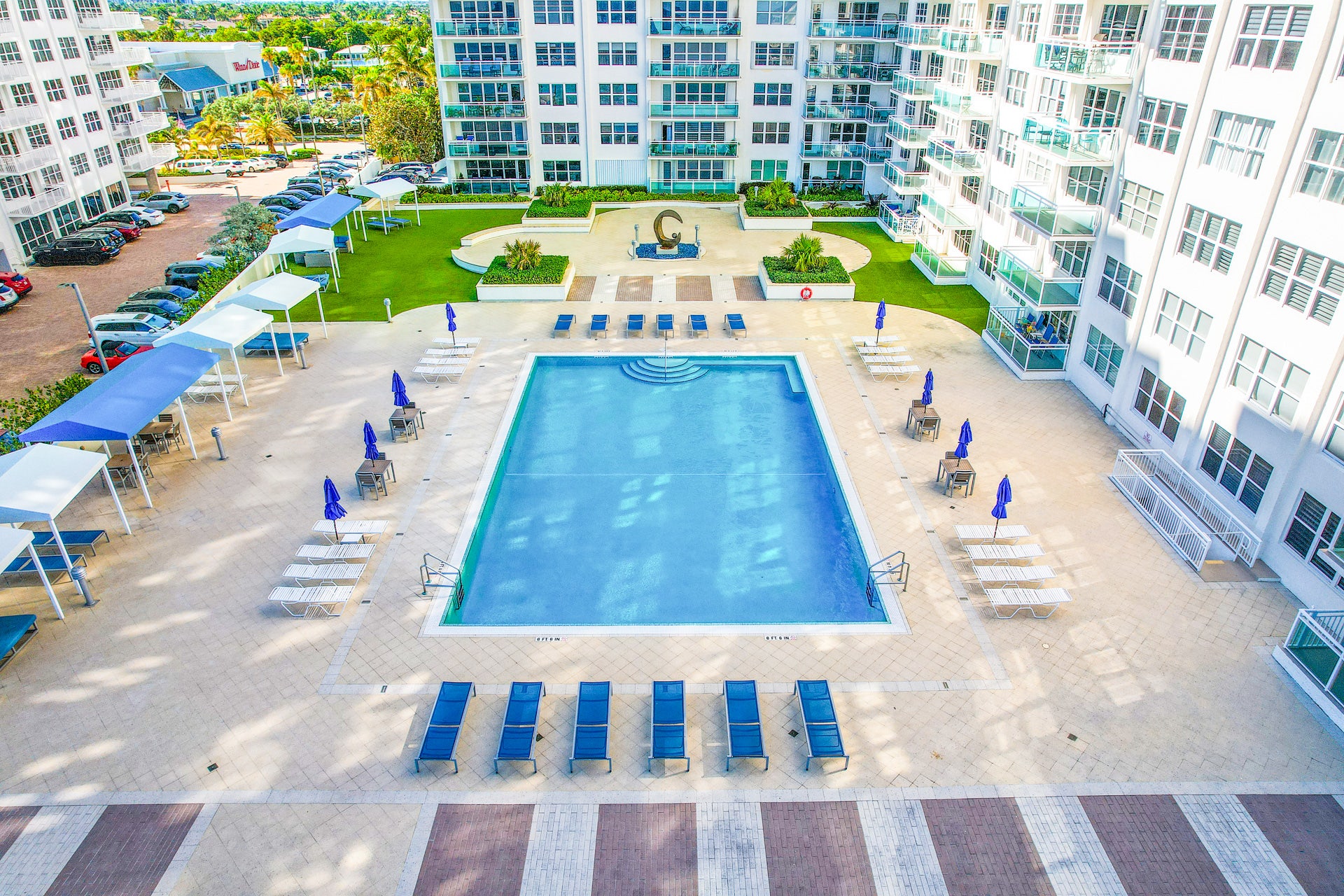Soak up the Florida sun on the expansive, resort-style pool deck at Playa Del Mar. This incredible luxury amenity space at 3900 Galt Ocean Dr elevates everyday living on the Galt Ocean Mile. Listed by Prestige Waterfront Realty. property photo of Soak up the Florida sun on the expansive, resort-style pool deck at Playa Del Mar. This incredible luxury amenity space at 3900 Galt Ocean Dr elevates everyday living on the Galt Ocean Mile. Listed by Prestige Waterfront Realty.