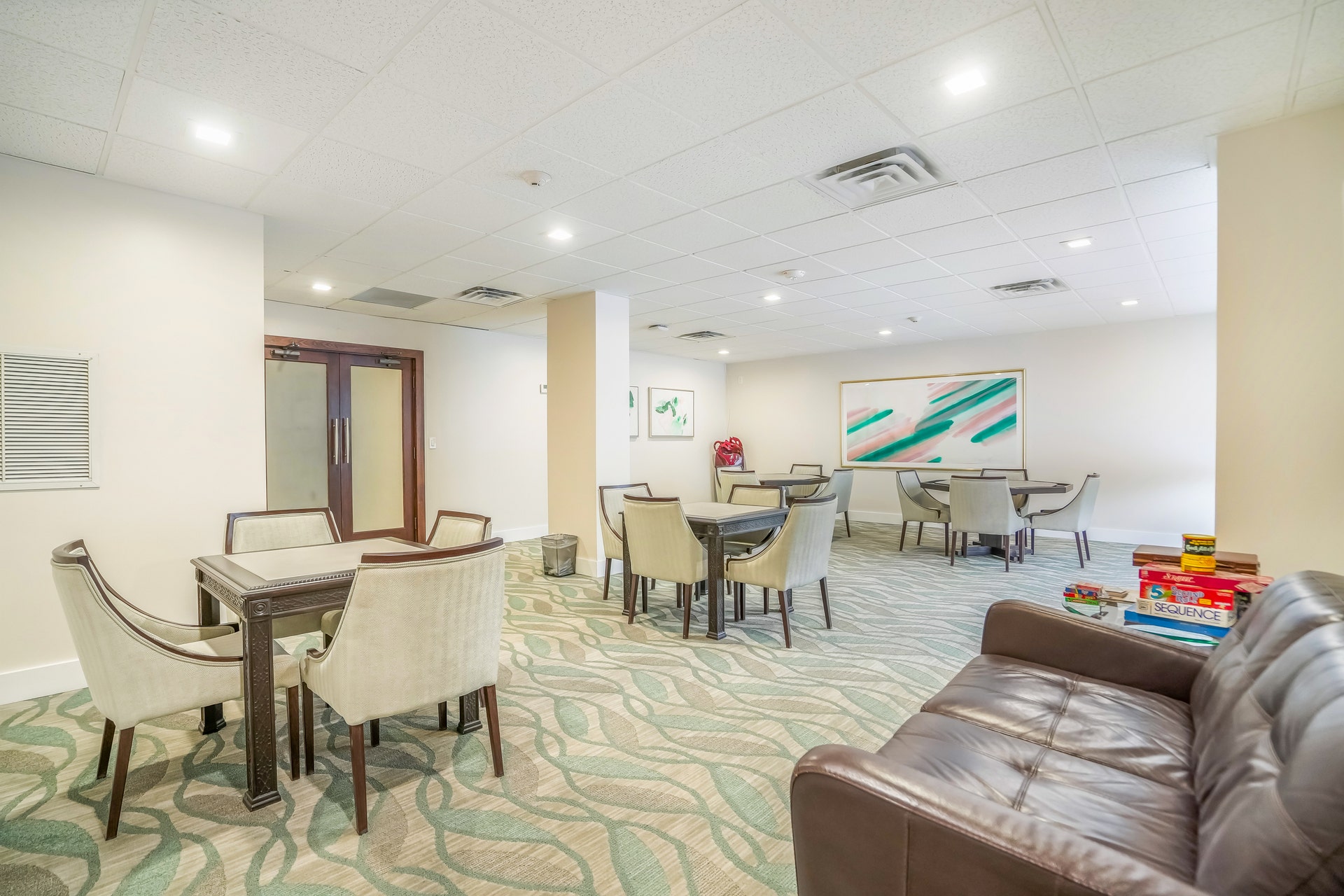 Formal seating and refined finishes define this community space at 3500 Galt Ocean Dr.