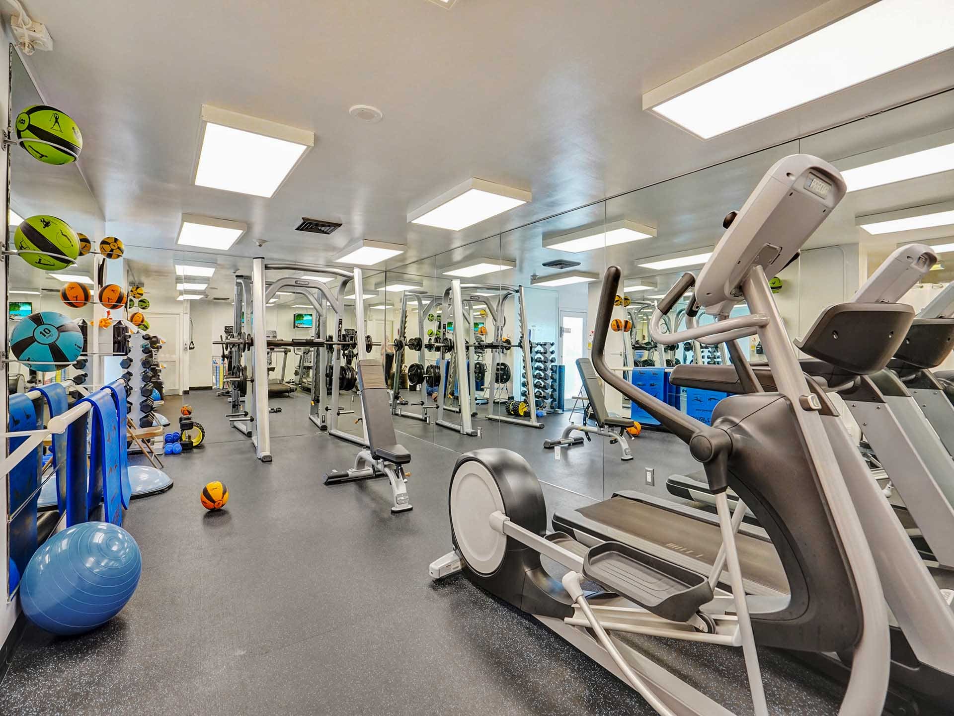 State-of-the-art cardio equipment, ellipticals, and weight training gear inside the Point of Americas fitness center.