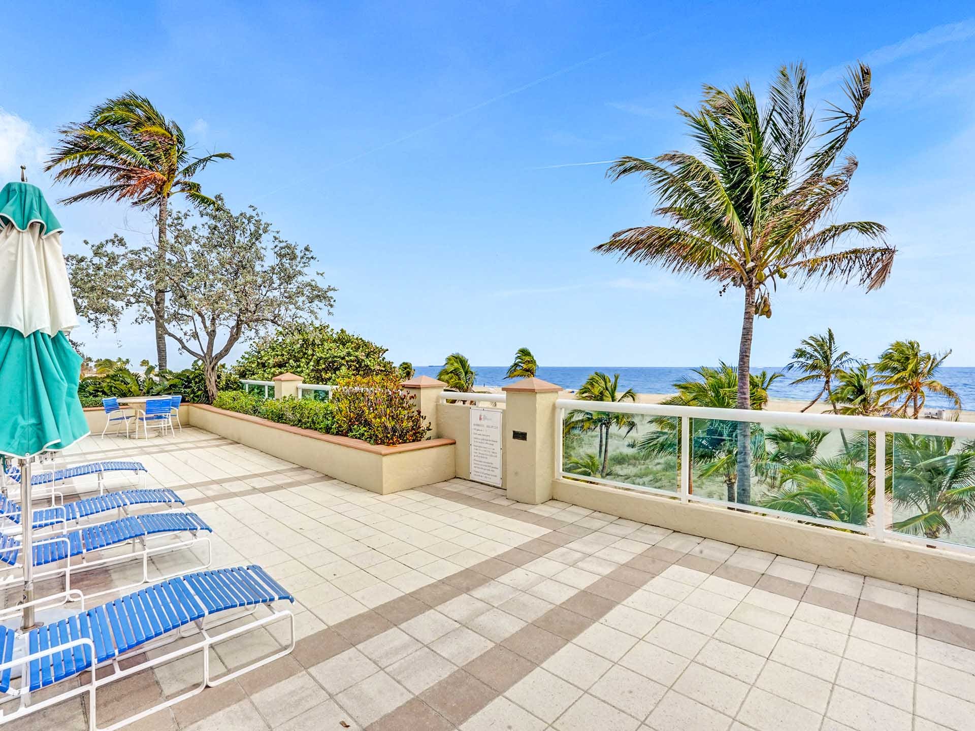 Enjoy sweeping views of the beach and ocean from the private, glass-lined sun deck at Point of Americas in Fort Lauderdale.