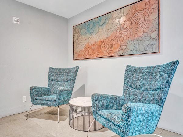 A stylish and quiet sitting area inside East Point Towers, reflecting the building's comfortable and well-maintained interior amenities.