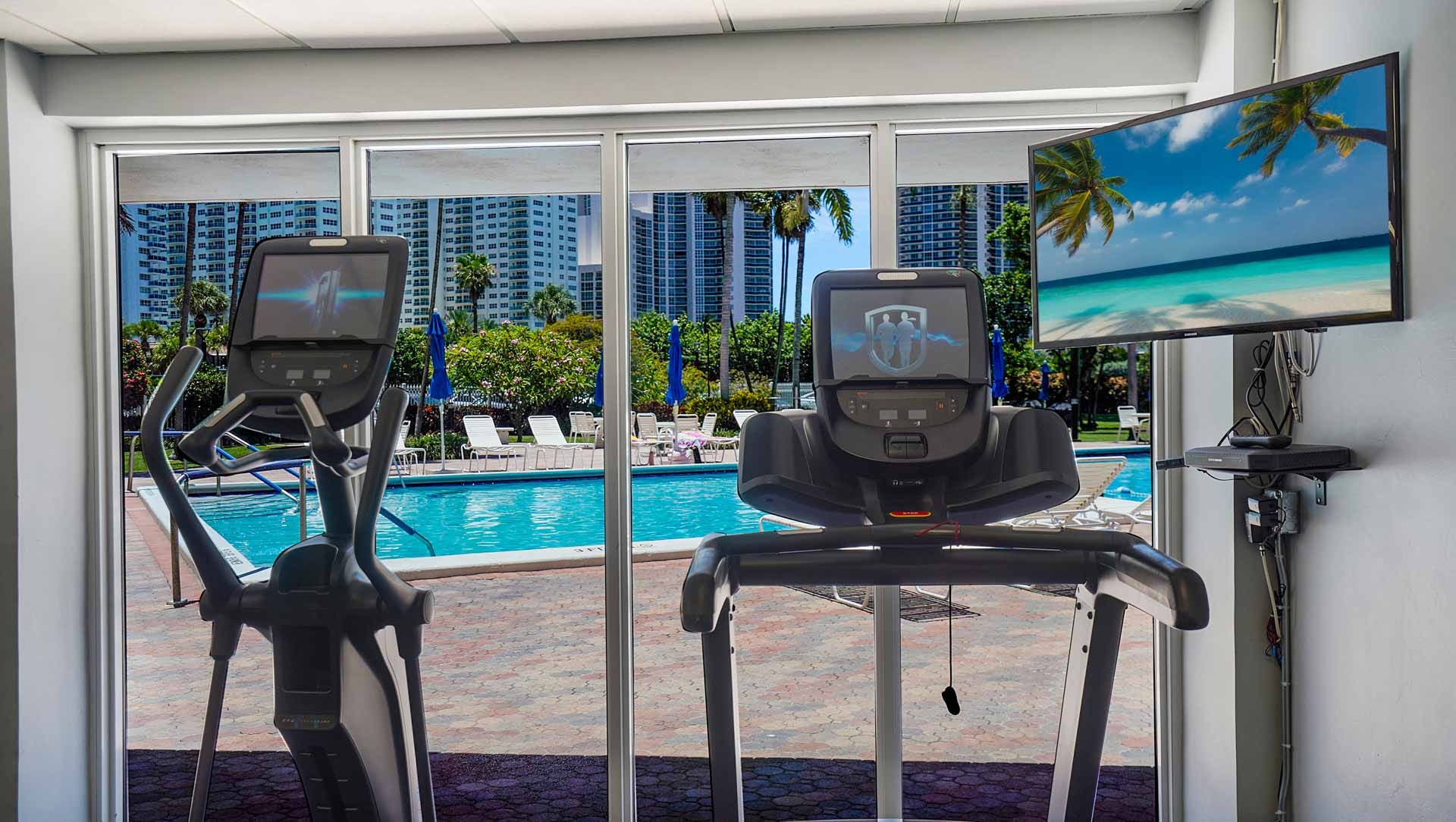 Maintain your wellness routine while enjoying serene, resort-style pool views from the fitness center at Coral Ridge Towers East. This vibrant Fort Lauderdale community provides an array of active lifestyle amenities, including a heated pool and clubhouse