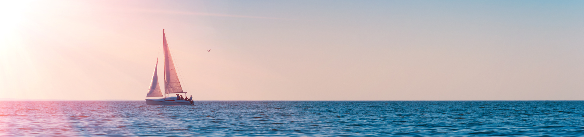 ocean with sunset and boat