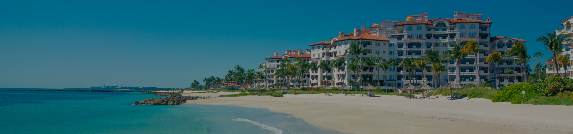 High-angle view of beachfront condominium towers along Gulf Boulevard in Treasure Island, Florida.