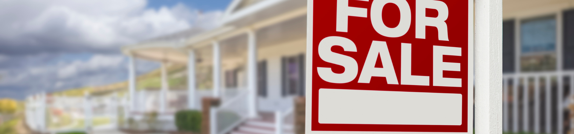 Home with for sale sign