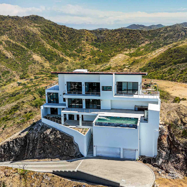 Luxury Papagayo real estate Villa Nayara, an eight bedroom modern home in Playas del Coco, Guanacaste, Costa Rica, featuring ocean-view terraces, infinity pool, and prime location for beachfront homes for sale.