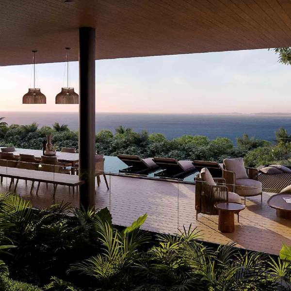 Terrace with dining area, lounge chairs, and infinity pool in Guanacaste.