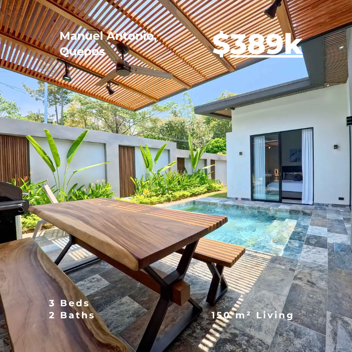Modern patio with wooden pergola, dining table, small pool, and sliding glass doors surrounded by tropical plants.