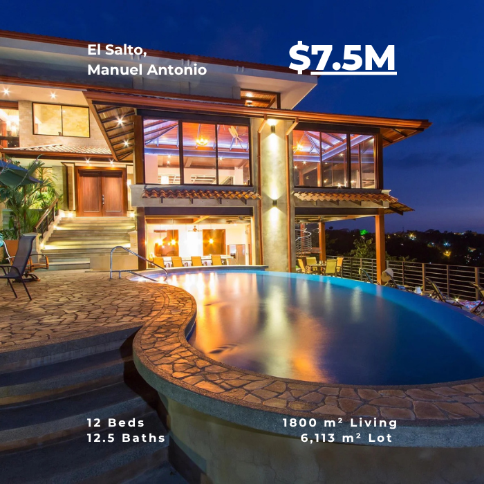 Large estate with curved pool, multiple levels, and warm interior lighting at night.