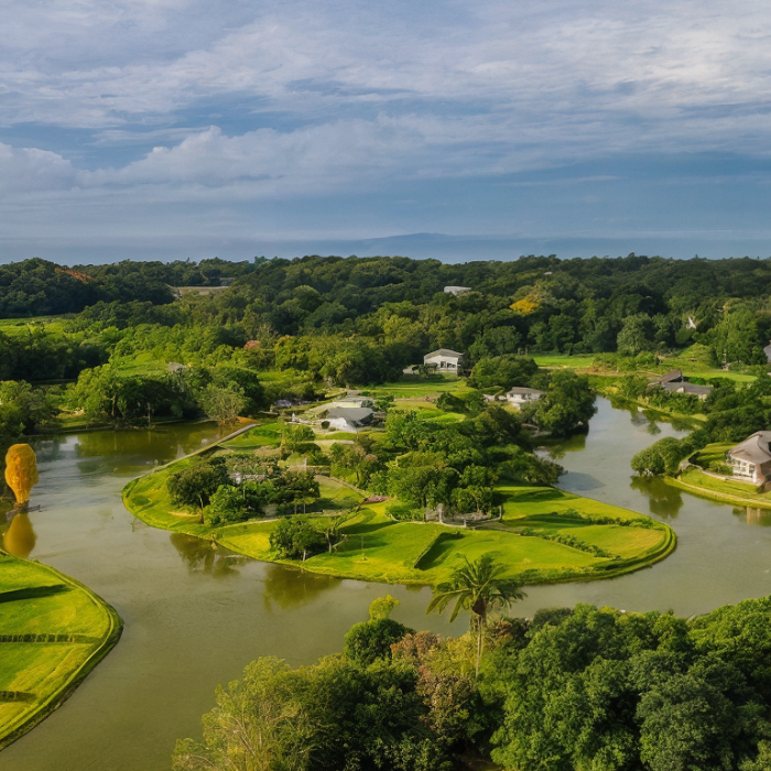 Aerial view of Mistico community in Playa Hermosa showing rivers, green islands, homes and tropical landscape.