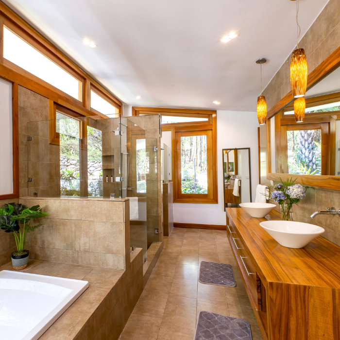luxury Bathroom with wood cabinetry and glass shower in Pérez Zeledón house