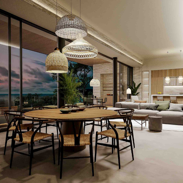 Dining area with glass walls and ocean views in a Guanacaste villa.